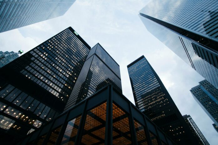 Photo by Sean Pollock low angle photo of city high rise buildings during daytime