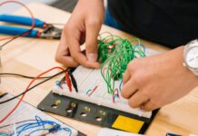 양자기술 국제표준 개발 한국에서 최초 시작 person holding black and white audio mixer