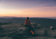 여름에 피해야 할 다이어트 실수들 person sitting on boulder overlooking mountain during golden hour