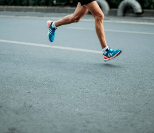 운동과 건강한 식습관으로 뼈 건강 유지하기 pair of blue-and-white Adidas running shoes