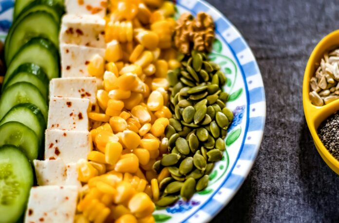 Photo by VD Photography yellow corn on white and blue ceramic plate