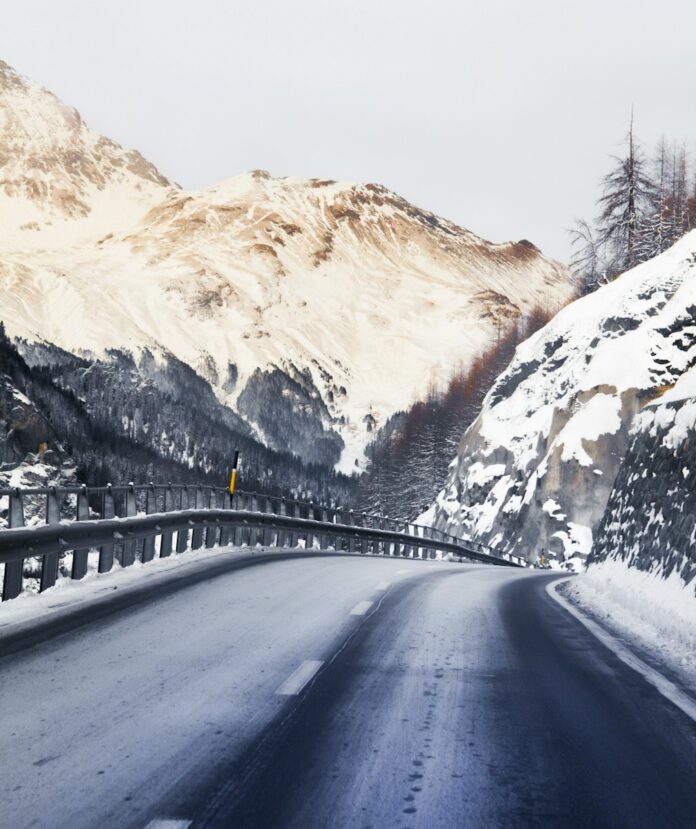 Photo by Point Blanq black car on road near snow covered mountain during daytime