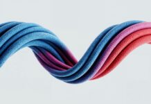 “손발이 자꾸 차가운 이유”…‘혈액순환’ 말고 봐야 할 의외의 원인 Colorful, wavy cables intertwine against a white background.