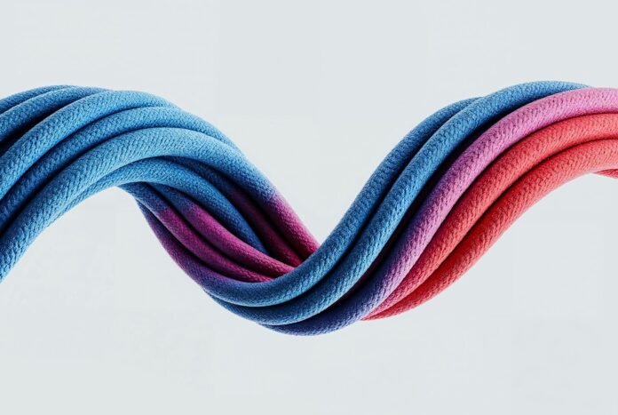 Colorful, wavy cables intertwine against a white background.