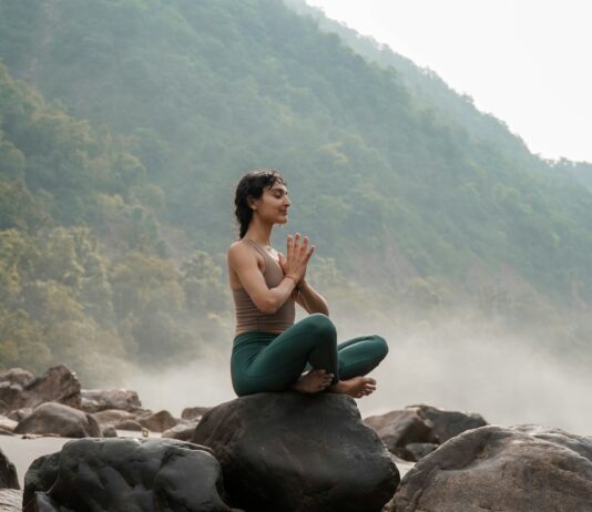 정신건강, 마음의 면역력을 키우는 첫걸음 a woman sitting on top of a rock next to a river