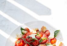식단, 꾸준함과 균형이 답이다… 최신 건강 트렌드 살펴보니 sliced tomato and green leaf vegetable on white ceramic plate